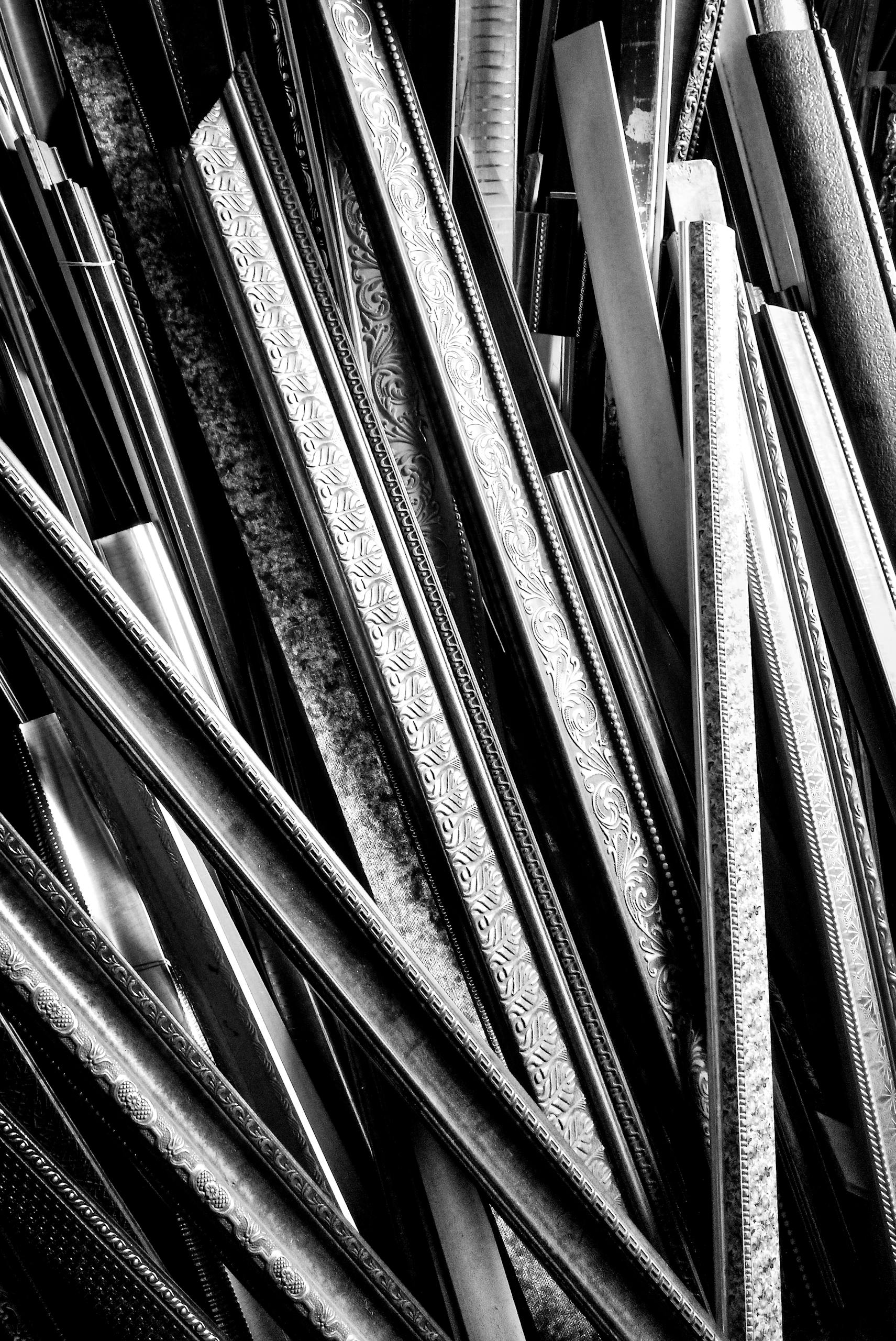 A striking black and white abstract photo highlighting wooden frame designs.